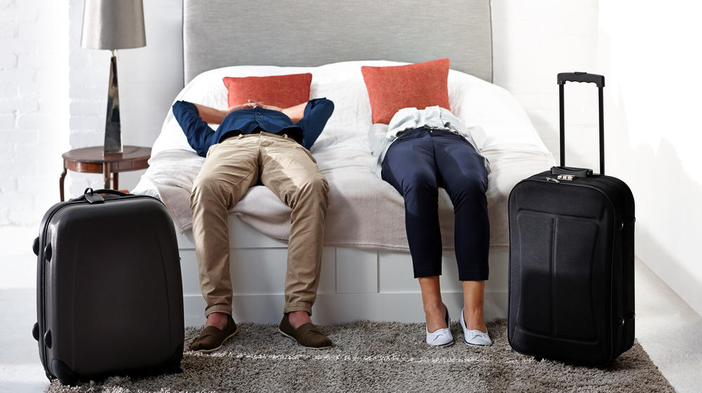 Couple in a hotel room with luggage