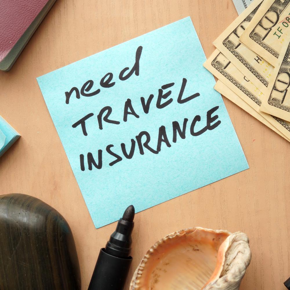 Notiz mit dem Text: Need Travel Insurance