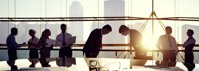 Greeting businessmen in conference room